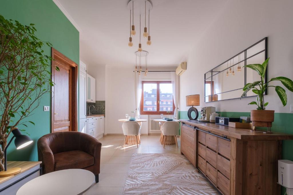 a kitchen with a counter and a dining room at Casita de Luna- Affittacamere Bologna in Bologna