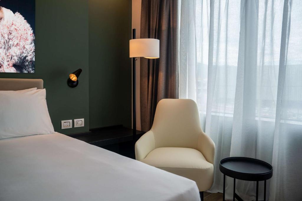 Postel nebo postele na pokoji v ubytování Radisson Blu Hotel, Bergamo ChorusLife
