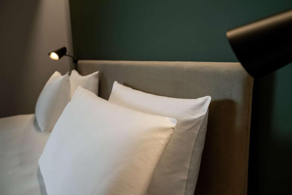 Postel nebo postele na pokoji v ubytování Radisson Blu Hotel, Bergamo ChorusLife