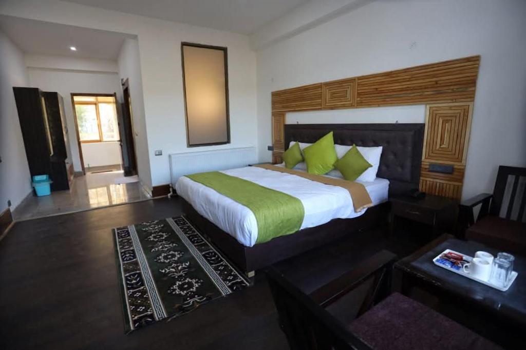 Ένα ή περισσότερα κρεβάτια σε δωμάτιο στο Zanskar Hostel and Rooms