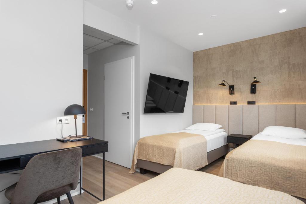 Postel nebo postele na pokoji v ubytování Alva Hotel Brautarholt