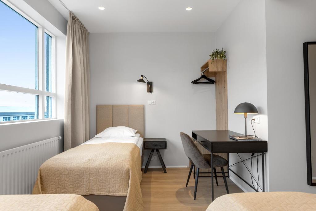Postel nebo postele na pokoji v ubytování Alva Hotel Brautarholt