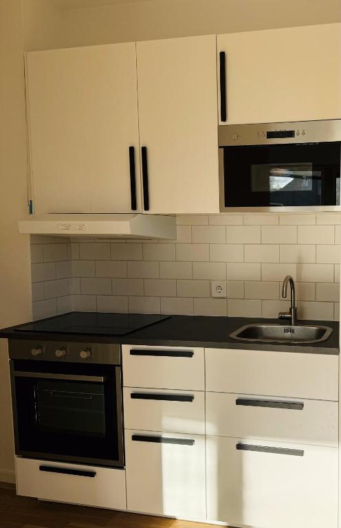 Kuchyň nebo kuchyňský kout v ubytování Örebro City Hostel