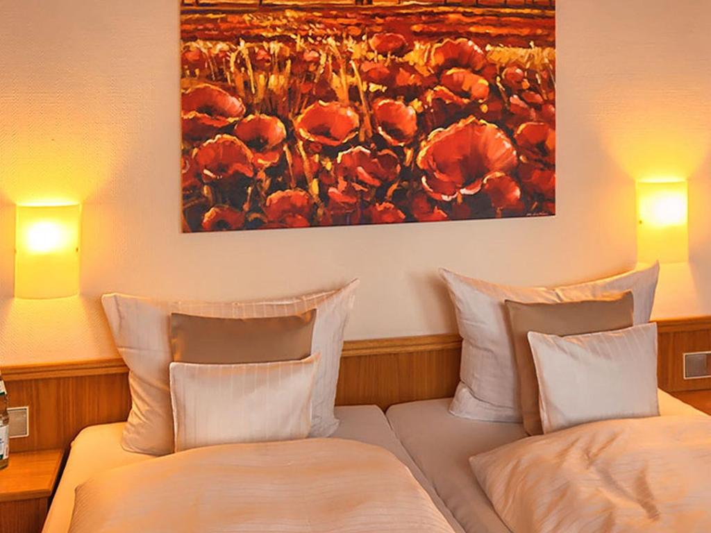 Postel nebo postele na pokoji v ubytování Hotel Burgblick