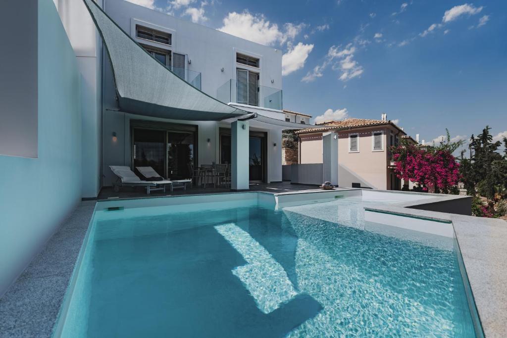 a swimming pool in the backyard of a villa at St Aims by Bluesites in Porto Heli