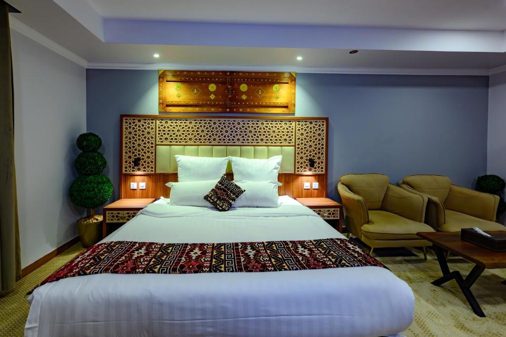 Postel nebo postele na pokoji v ubytování Zaman Homeland Hotel