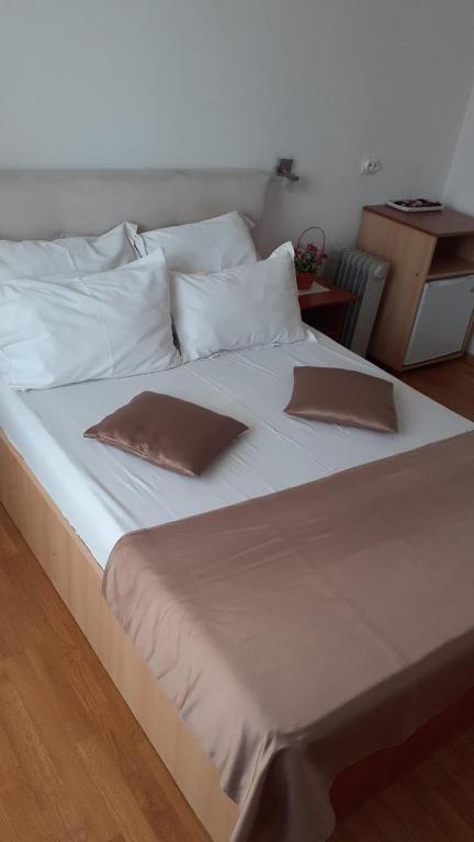 Postel nebo postele na pokoji v ubytování Hotel Sucidava