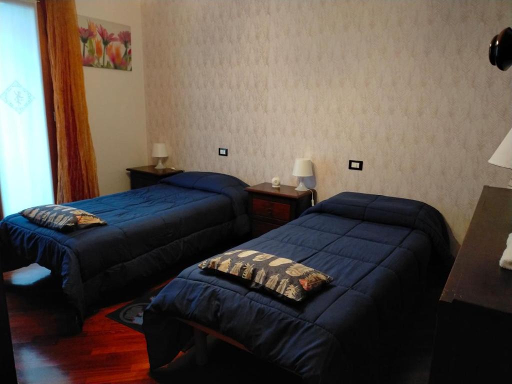 Postel nebo postele na pokoji v ubytování La tua casa meravigliosa con giardino
