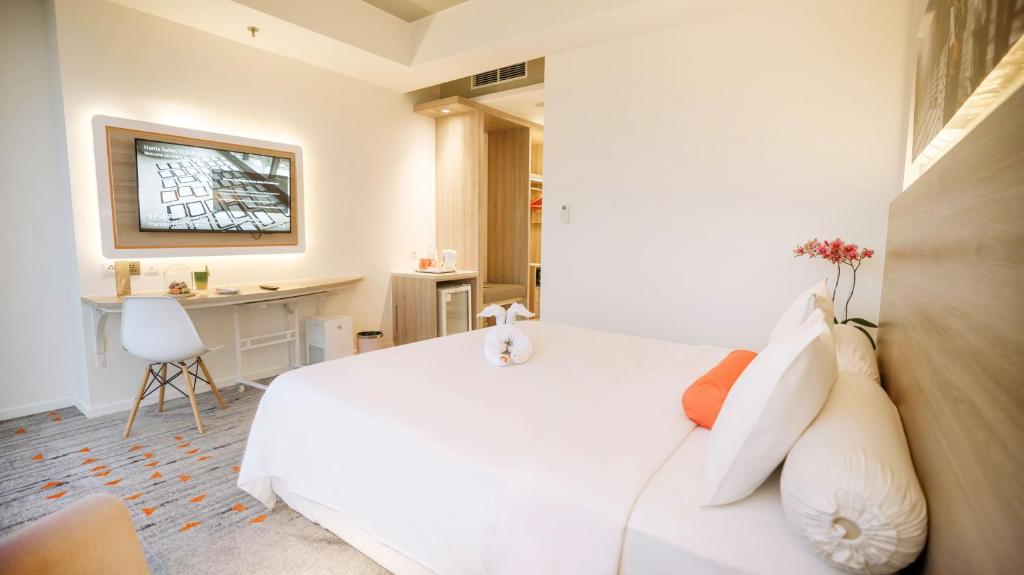 Letto o letti in una camera di HARRIS Suites fx Sudirman