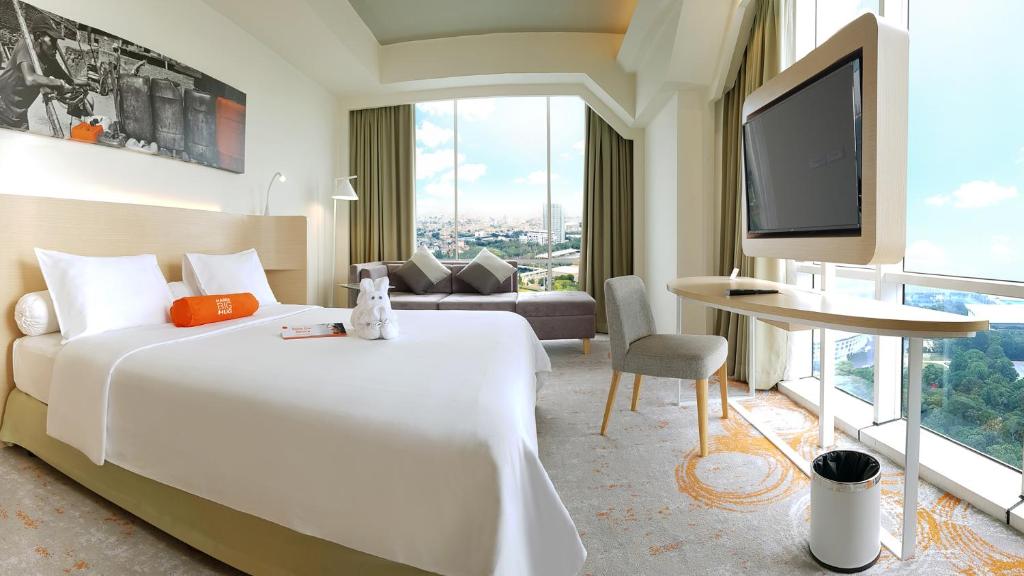 Letto o letti in una camera di HARRIS Suites fx Sudirman