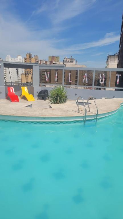 a view of a swimming pool on top of a building at MONOAMBIENTE VILAUT Temporario in Córdoba