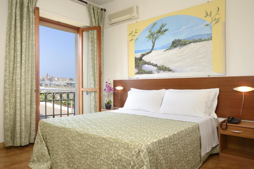 Postel nebo postele na pokoji v ubytování Hotel Il Gabbiano