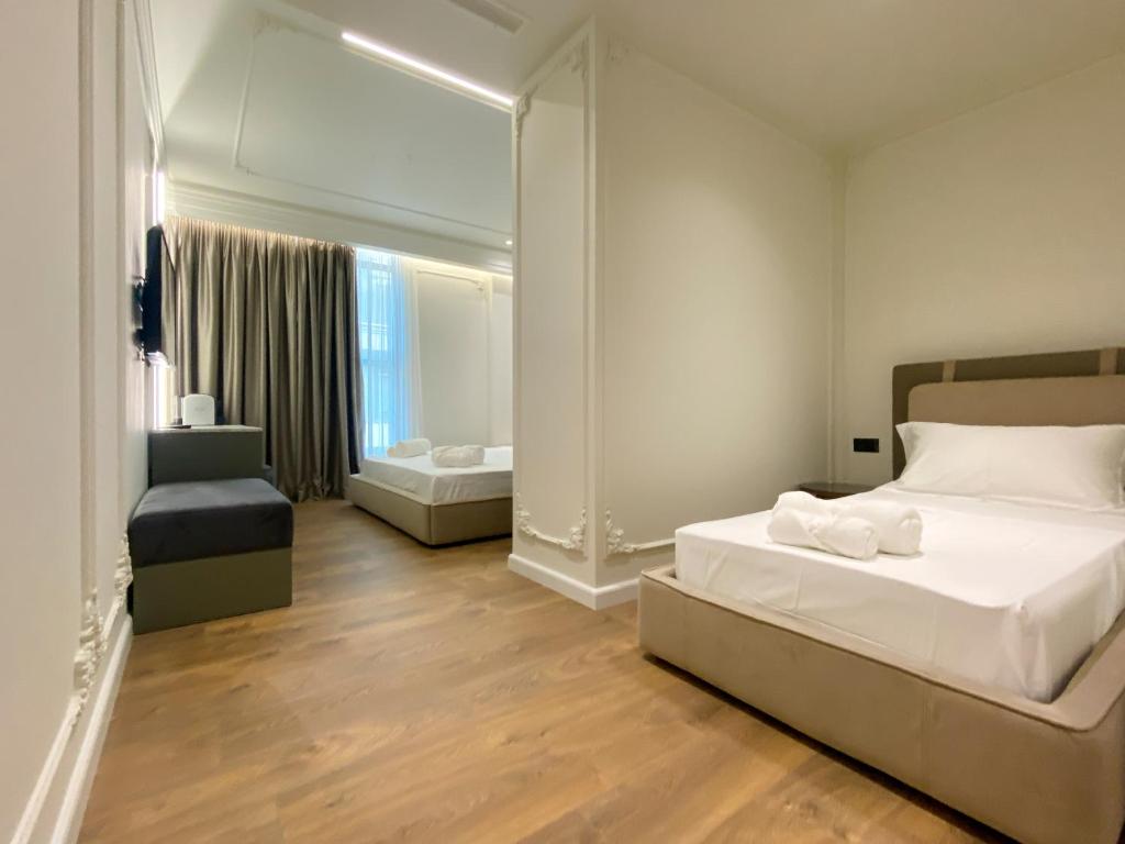 Postel nebo postele na pokoji v ubytování Adore Boutique Hotel