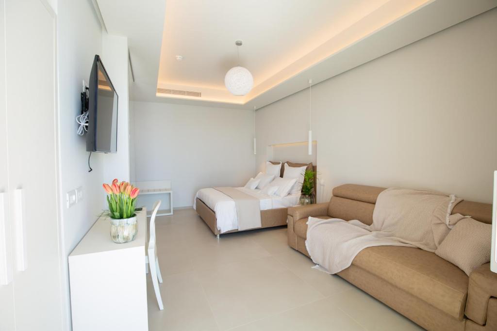 TV a/nebo společenská místnost v ubytování Scirocco Boutique Eco Hotel