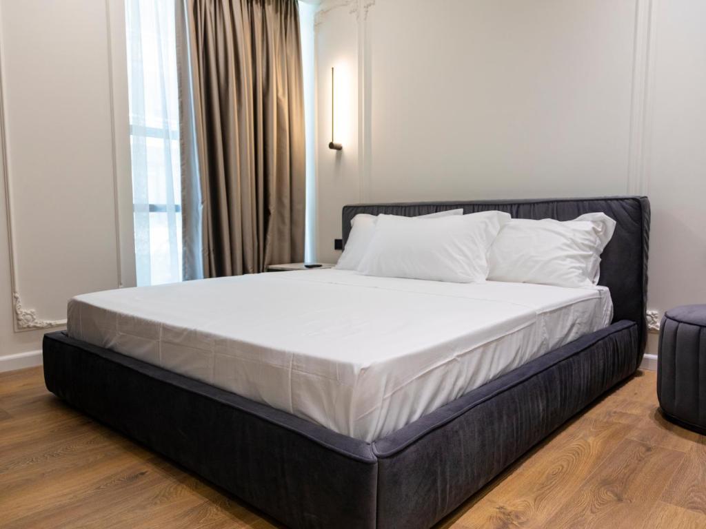 Postel nebo postele na pokoji v ubytování Adore Boutique Hotel
