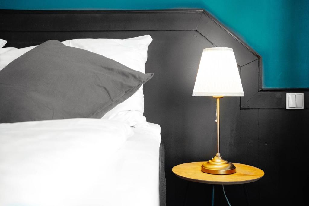 Postel nebo postele na pokoji v ubytování Hotel Praga 1885 by Wagnerstays