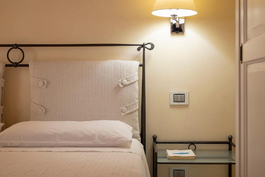 Łóżko lub łóżka w pokoju w obiekcie Podere Vignanova Accommodations & SPA