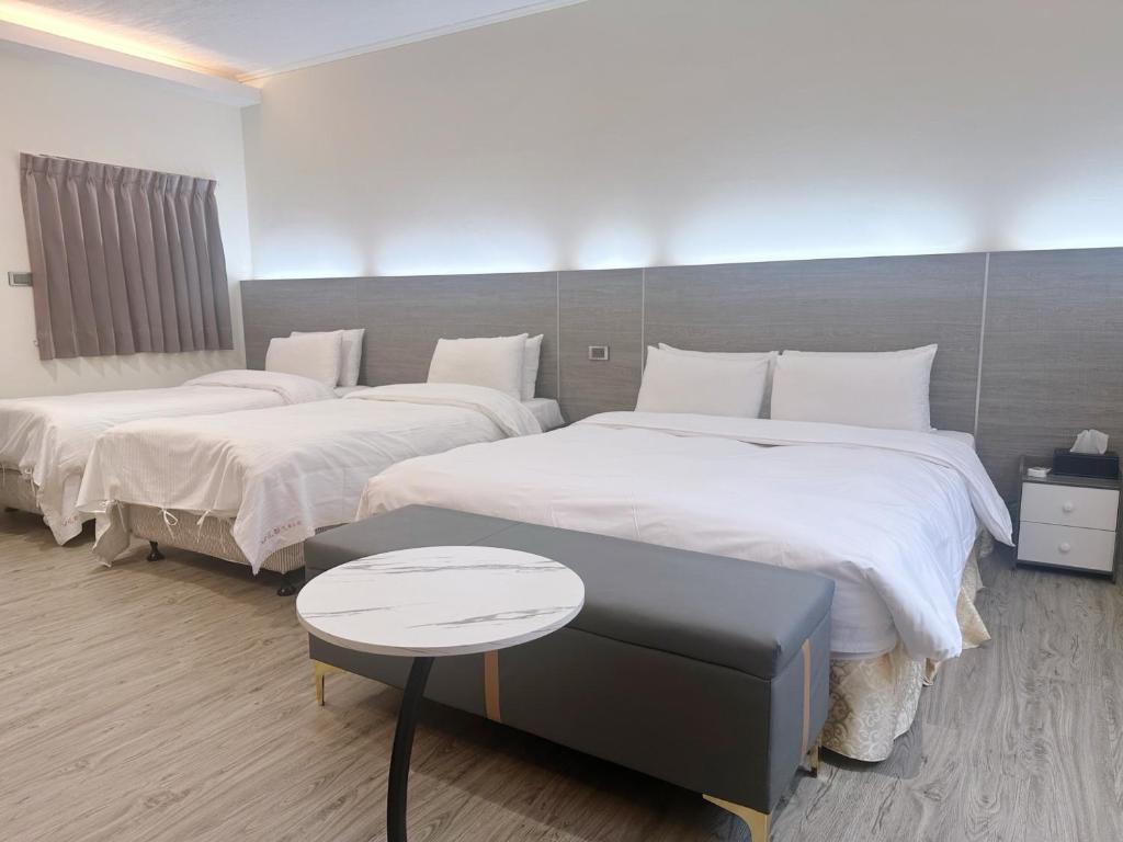Postel nebo postele na pokoji v ubytování Hua Du Motel