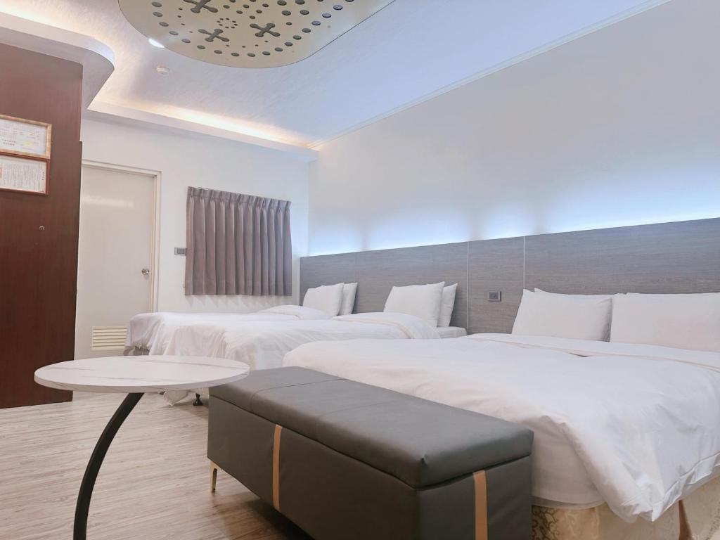 Postel nebo postele na pokoji v ubytování Hua Du Motel