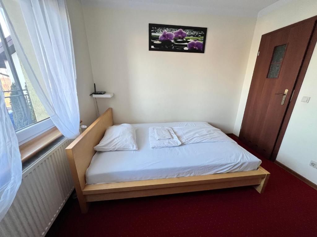 Postel nebo postele na pokoji v ubytování Noclegi AirportPark