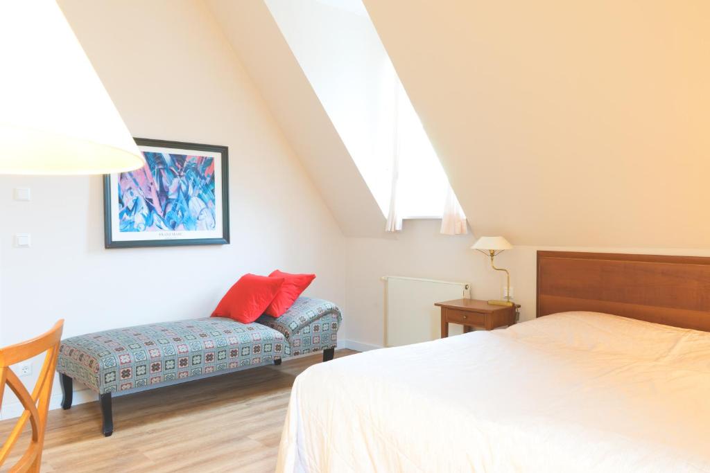 Postel nebo postele na pokoji v ubytování Hotel Villa Viktoria Luise