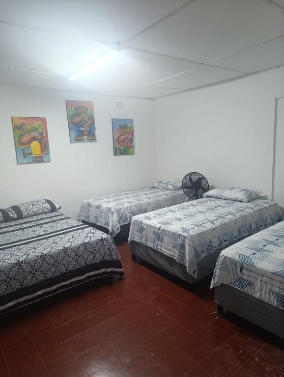 Letto o letti in una camera di Hostal Amanecer del Valle