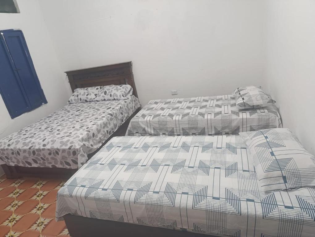 Letto o letti in una camera di Hostal Amanecer del Valle