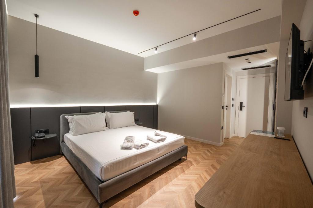 Postel nebo postele na pokoji v ubytování Sasso Hotel