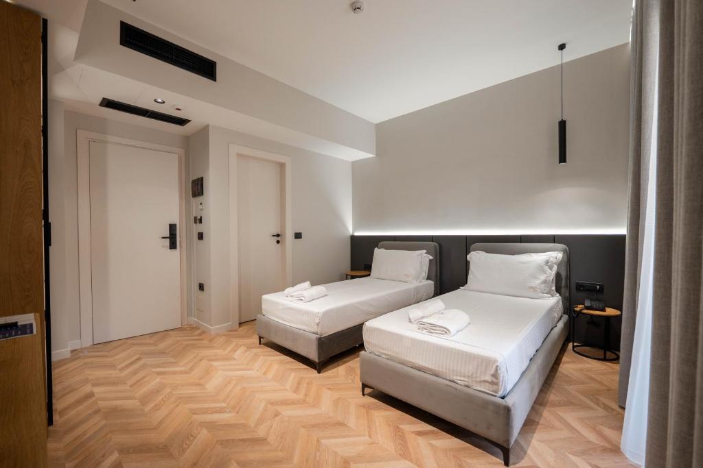 Postel nebo postele na pokoji v ubytování Sasso Hotel