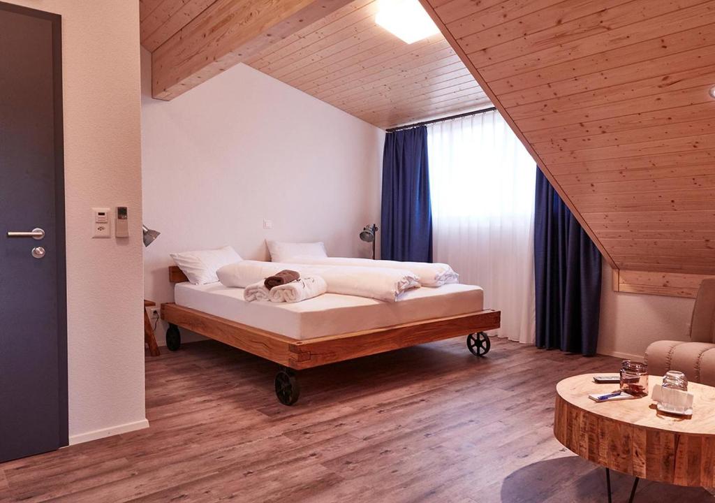 Postel nebo postele na pokoji v ubytování Auberge Passepartout