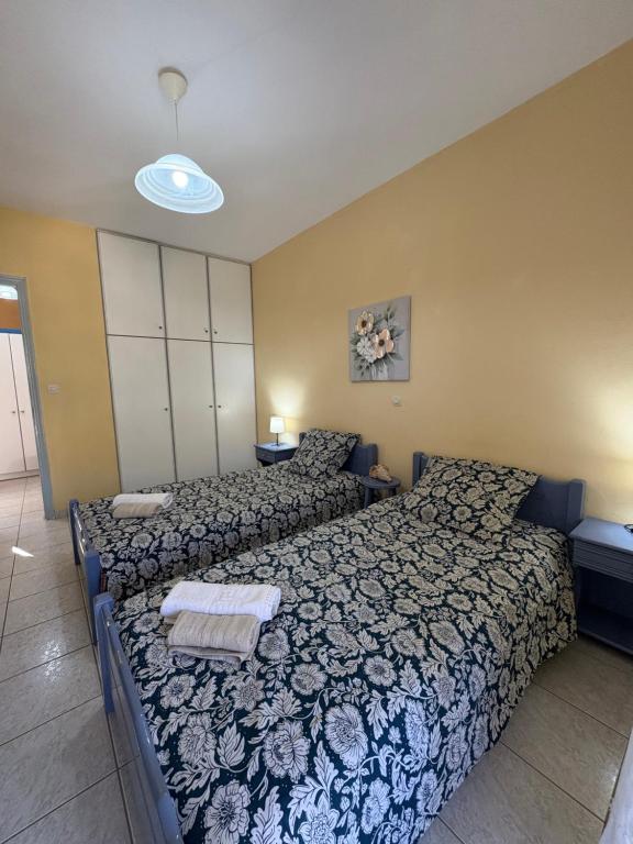 Postel nebo postele na pokoji v ubytování Myrtos Hotel