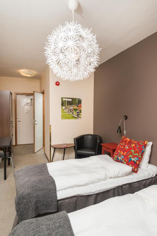 Postel nebo postele na pokoji v ubytování Hotell Fridhemsgatan