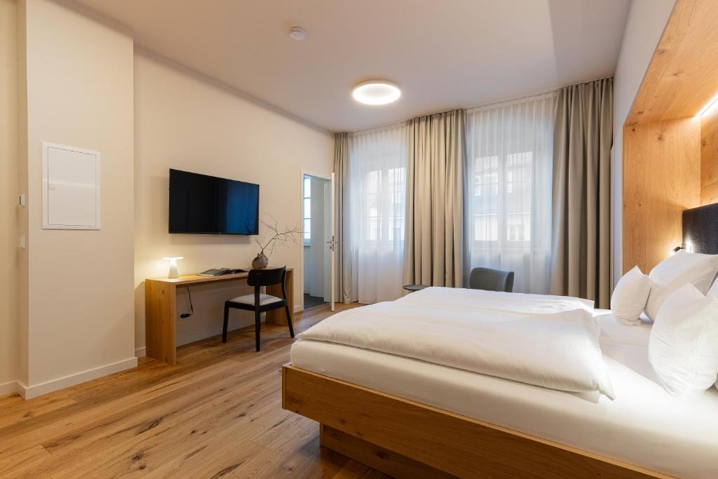 TV a/nebo společenská místnost v ubytování Boutique Hotel grüner Zweig