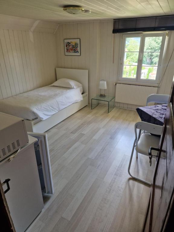 Postel nebo postele na pokoji v ubytování Apart-Hôtel Pont-de-Thielle