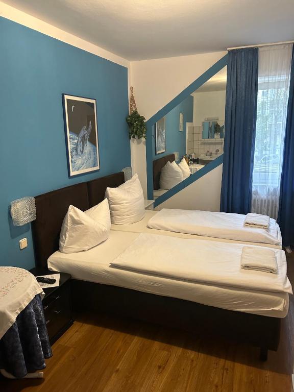 Postel nebo postele na pokoji v ubytování Hotel Pension Haydn
