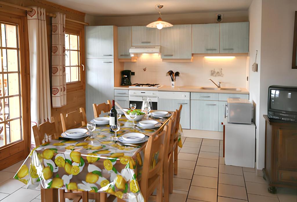 Kuchyň nebo kuchyňský kout v ubytování Appartement moderne à Châtel 60 m² avec terrasse privée