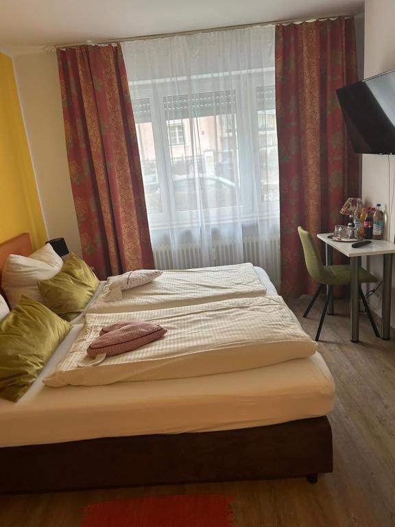 Postel nebo postele na pokoji v ubytování Hotel Pension Haydn