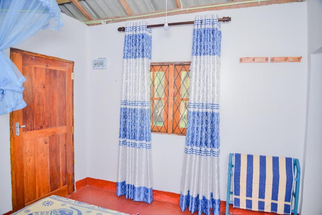 Postel nebo postele na pokoji v ubytování Pradeepa house