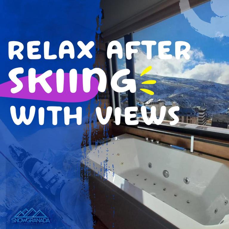 a bath tub in a bathroom with a window at SnowGranada Love Snow Jacuzzi in Sierra Nevada