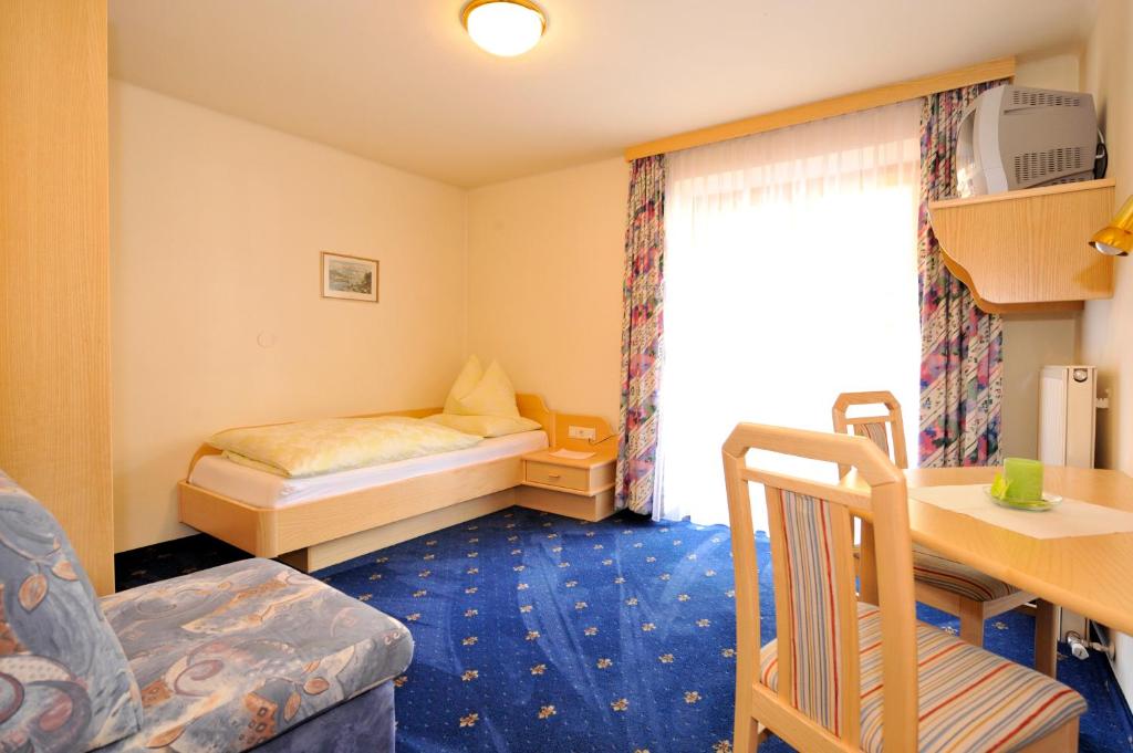 Postel nebo postele na pokoji v ubytování Hotel-Restaurant Schwaiger***
