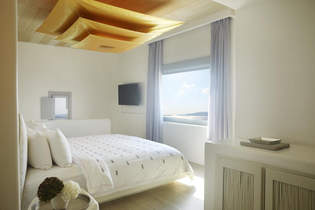 Postel nebo postele na pokoji v ubytování Cavo Tagoo Mykonos