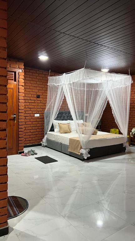 Postel nebo postele na pokoji v ubytování adam's apple homestay