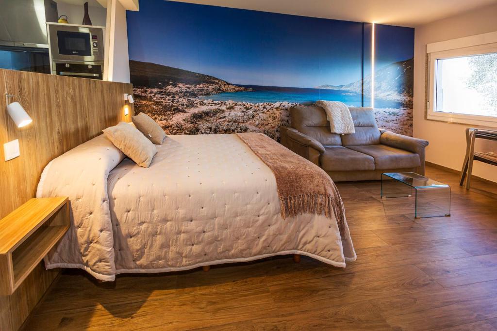 Postel nebo postele na pokoji v ubytování TOURIÑÁN MAR