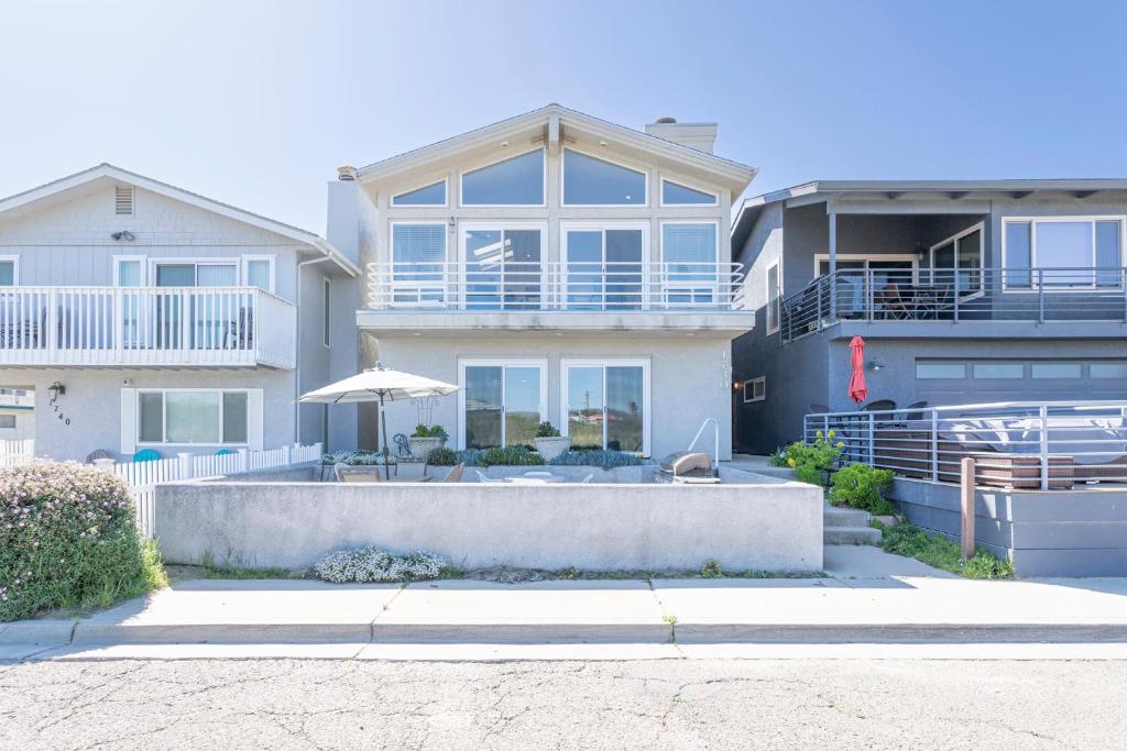 a large house with an umbrella in front of it at 1730 Laguna Drive in Oceano