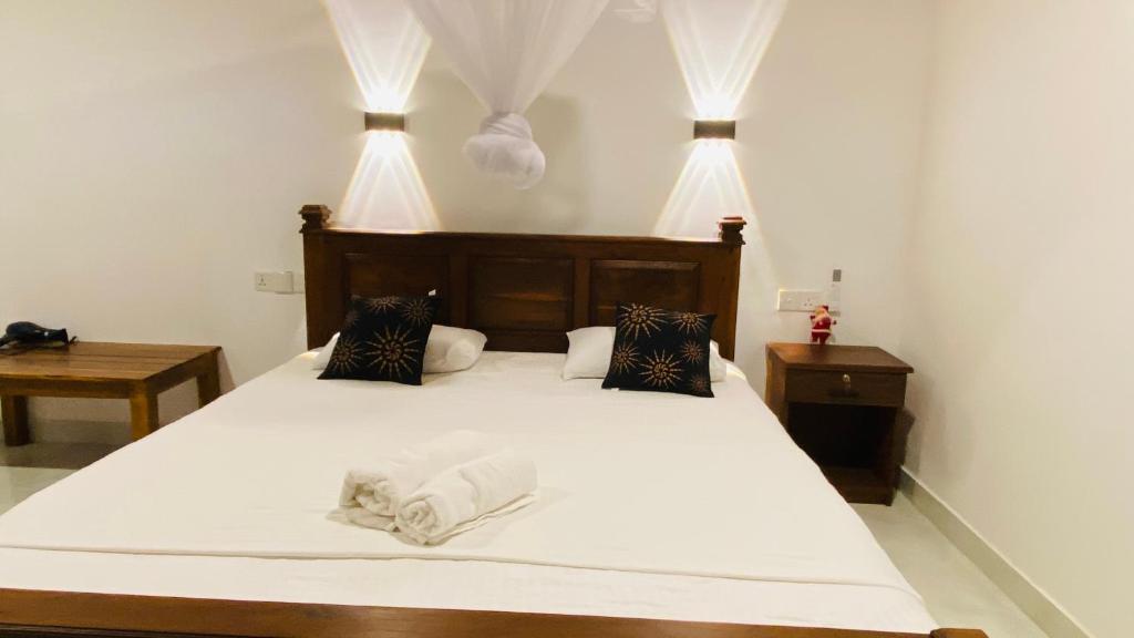 Postel nebo postele na pokoji v ubytování Fairview Dill homestay
