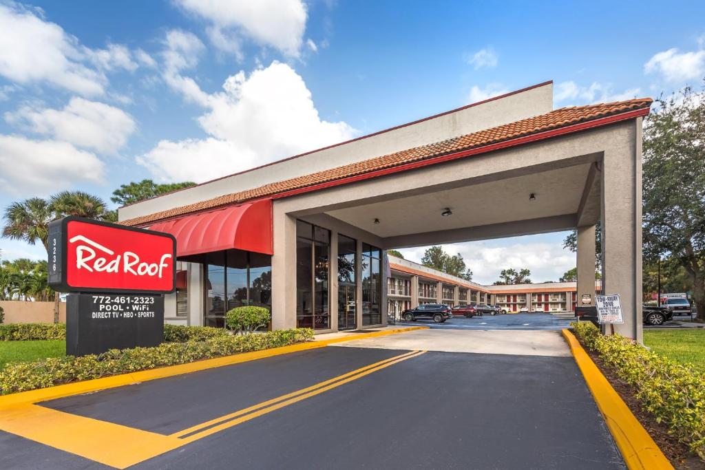 a k rite aid building with a red roof at Red Roof Inn Ft Pierce in Fort Pierce