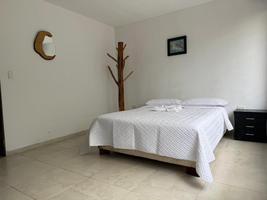 Voodi või voodid majutusasutuse Casa tranquila con jardín en Mocoa toas