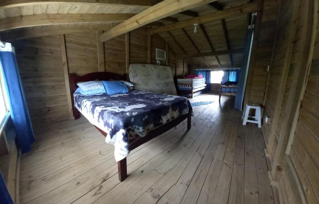 Giường trong phòng chung tại Morada Ipê Amarelo