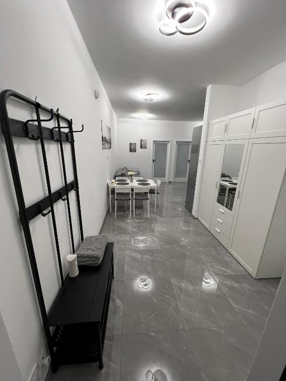 a room with a table and a dining room at Apartament Rodzinny 2 Ostrowiec Świętokrzyski in Ostrowiec Świętokrzyski