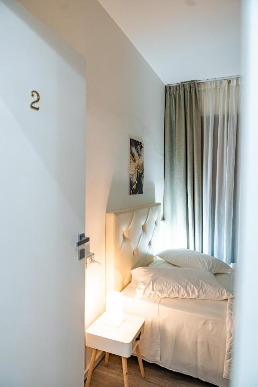 Posteľ alebo postele v izbe v ubytovaní Florence Rooms Novella